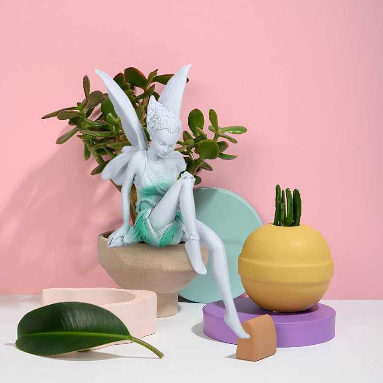 tudor and turek sitting fairy statue